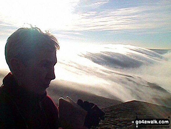 Early morning clouds rolling quickly over the edge on Stoodley Pike