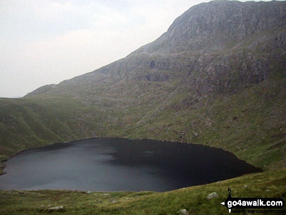 Bow Fell (Bowfell) (North Top) towering above Angle Tarn (Langdale)