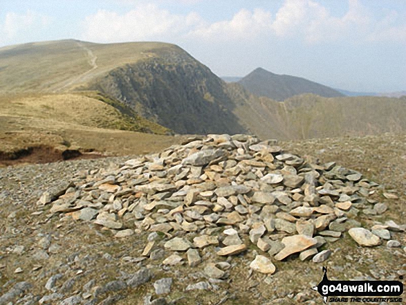 Nethermost Pike summit cairn with Helvellyn and Catstye Cam beyond