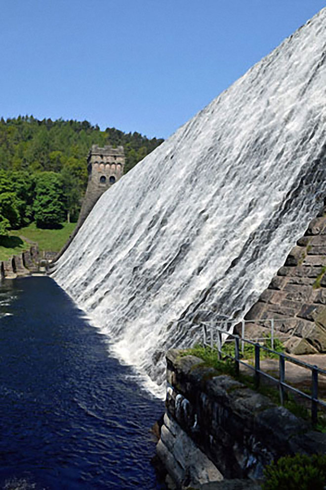 Water cascading over Howden Reservoir Dam