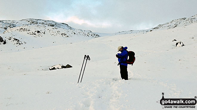 Walk c172 Scafell Pike via The Corridor Route from Wasdale Head, Wast Water - Checking the GPS on Sty Head in the snow