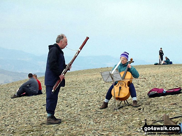 Walk c427 Helvellyn via Striding Edge from Patterdale - Musicians on the summit of Helvellyn