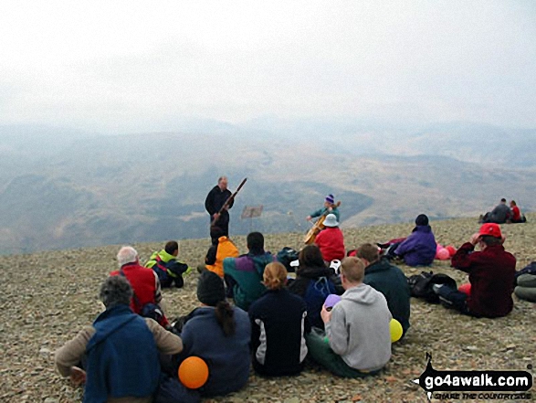 Walk c427 Helvellyn via Striding Edge from Patterdale - Musicians on the summit of Helvellyn