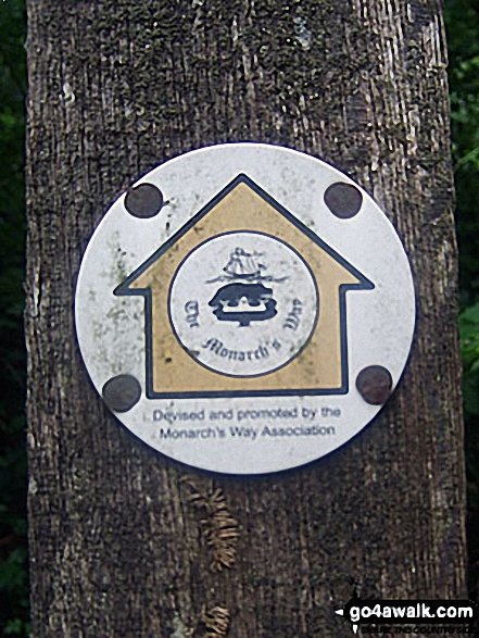 The Monarch's Way waymarker in Eartham Woods