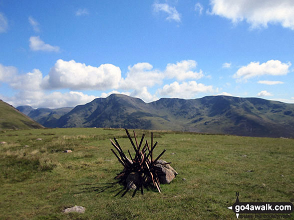 The cairn and tangle of old fence posts that mark the summit of Little Dodd (Ennerdale)