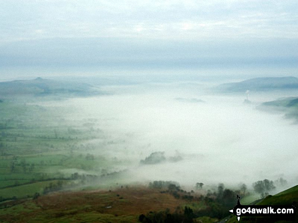 Mist drifting over Castleton the Hope Valley from Mam Tor