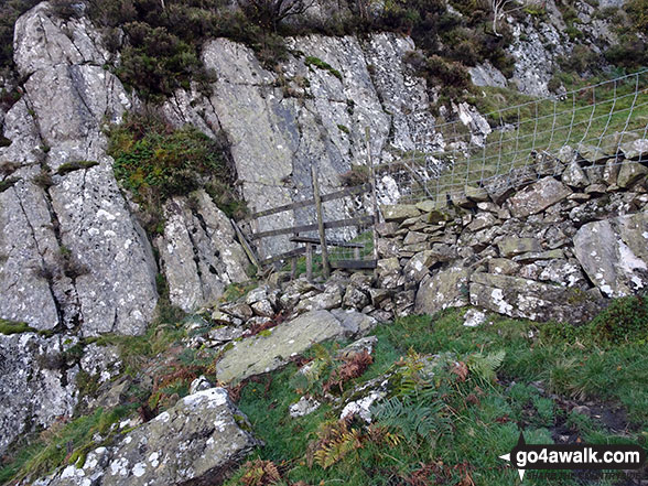 Walk c369 High Raise, Ullscarf and Grange Fell from Rosthwaite - Wonky stile on the route up Eagle Crag