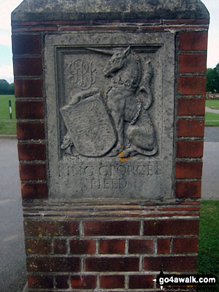 Walk ws154 Westfield and Barnham from Yapton - Carving on the gate post at the entrance to King George's Field, Yapton