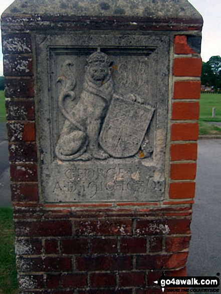 Walk ws154 Westfield and Barnham from Yapton - Carving on right-hand gate post at the entrance to King George's Field, Yapton