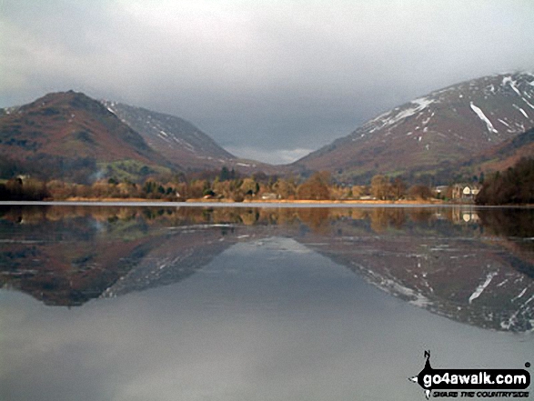 Walk c292 Rydal and Grasmere from Ambleside - Helm Crag & Steel Fell (left), Grasmere Village & Dunmail Raise (centre) and Seat Sandal (right) beautifully reflected in Grasmere