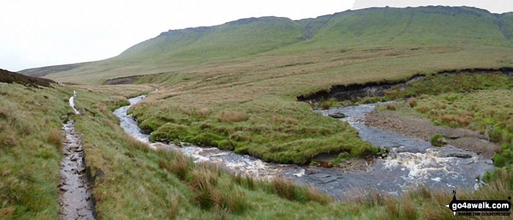 The River Ashop in Ashop Clough with The Kinder Scout Plateau above