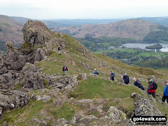 Runaway Ramblers from Bury approach 'The Lion and the Lamb' on Helm Crag