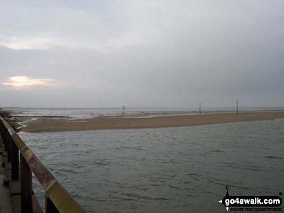 Poles marking The Pilgrim's Way across the Holy Island Sands from The St Cuthbert's Way on Lindisfarne Causeway