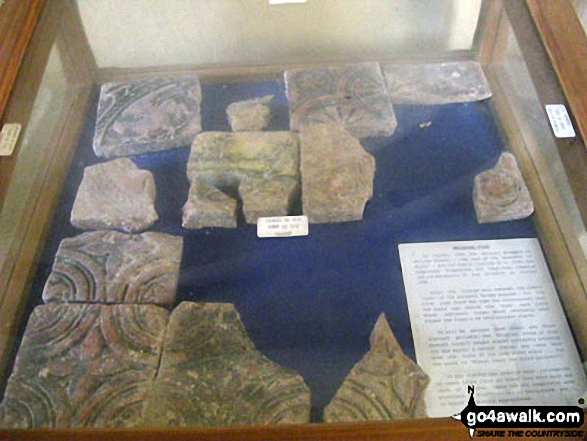 Walk s212 Blore, The River Dove and Mappleton from Swinscoe - Display case containing medieval tiles inside St. Bartholomew's Church, Blore