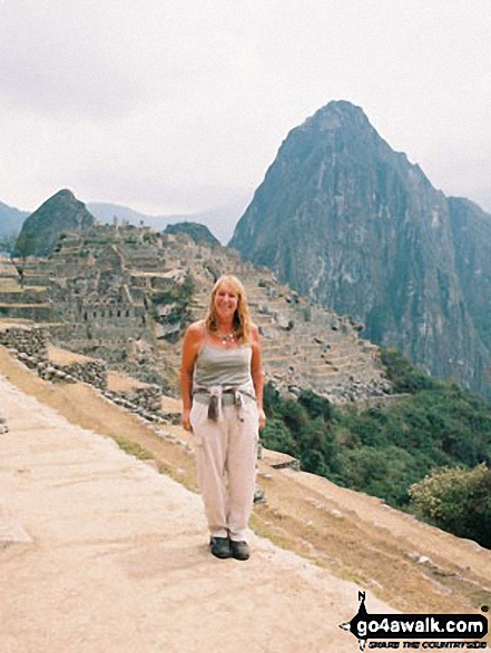 A very happy me on Machu Picchu with Wayna Picchu in the background in The Andes  Peru