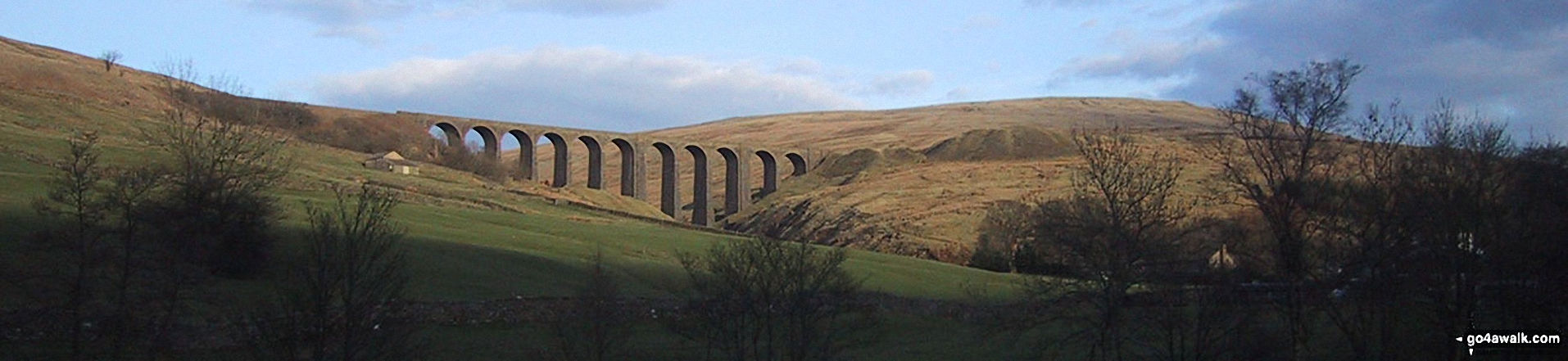 The Arten Gill Beck railway viaduct and Wold Fell from near Cowgill