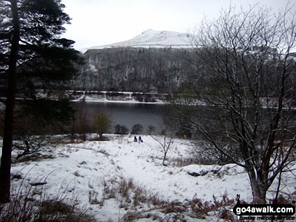 Crook Hill beyond Ladybower Reservoir from Wiseman Hey Clough Woods, Winhill Pike (Win Hill) in heavy snow