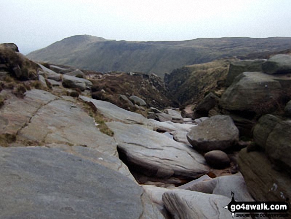 At the top of Grindsbrook Clough with Grindslow Knoll (Kinder Scout) in the distance