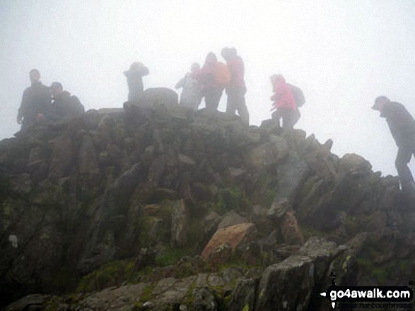 Walk gw126 Snowdon via The Llanberis Path - This is a pic of my boyfriend mounting the steps to the summit of Snowdon in rather foggy conditions!