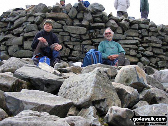 Walk c215 Scafell Pike from Seathwaite (Borrowdale) - Me and my Dad, having a well earned rest at the top of Scafell Pike having completed all three peaks in the UK National Three Peaks Challenge.