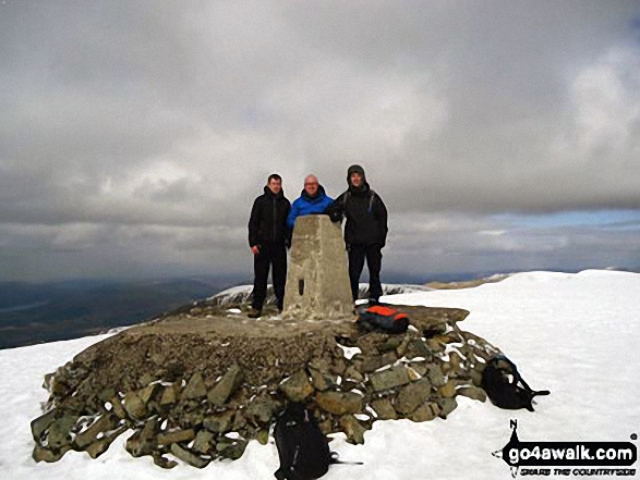 On Ben Nevis summit trig point in the snow