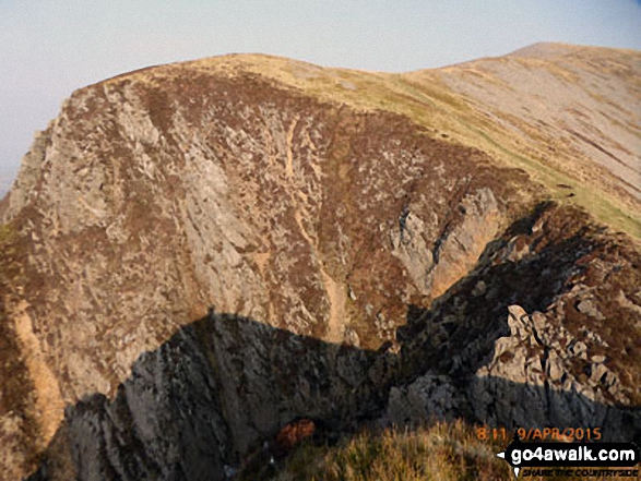 The crags of Craig y Bera with Mynydd Mawr (Llyn Cwellyn) beyond