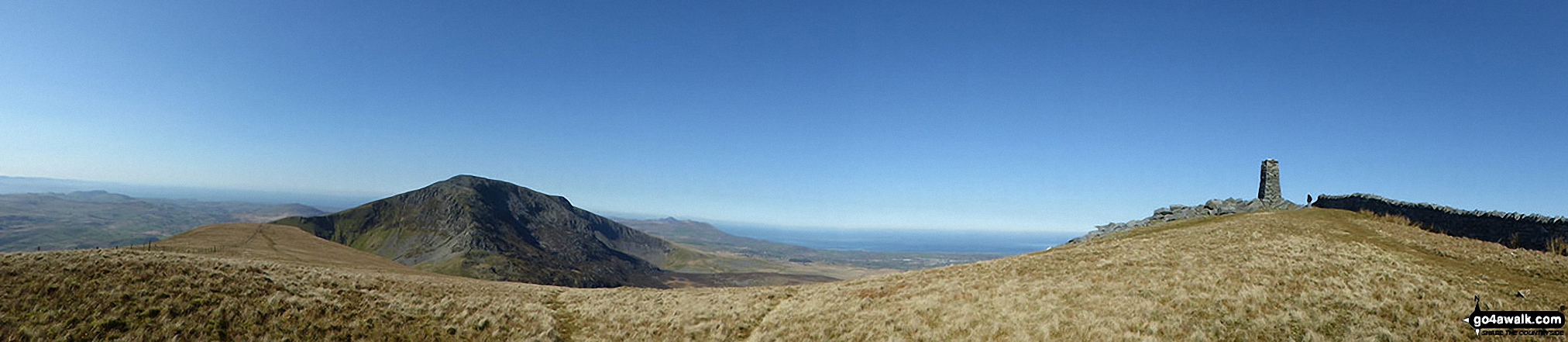 Craig Cwm Silyn (mid-ground) and Yr Eifl (The Rivals) on The Llyn peninsula (in the distance) and The Jubilee Monument Obelisk on the summit of Mynydd Tal-y-mignedd