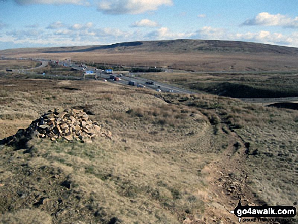 Approaching Lads Grave and The M62 via The Pennine Way across Slippery Moss