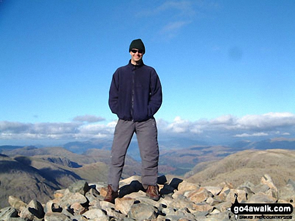 Me, cos my partner wouldn't stand there. on Scafell Pike in The Lake District Cumbria England