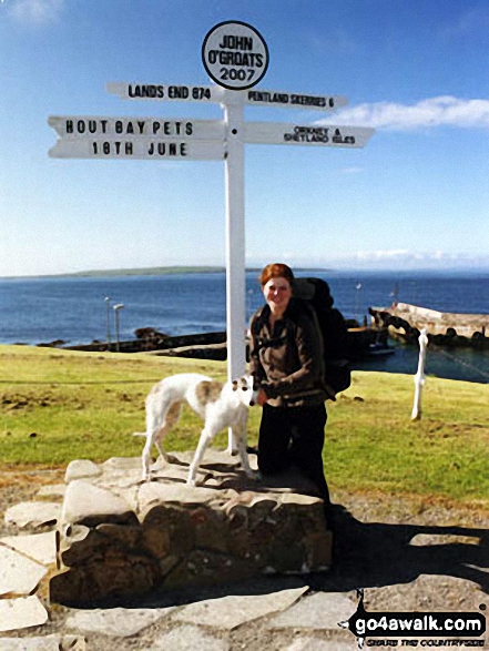 Katherine Arzul and her dog Millie at John O'Groats