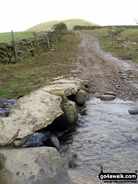 The Pennine Way crossing Great Rundale Beck with Knock Pike beyond