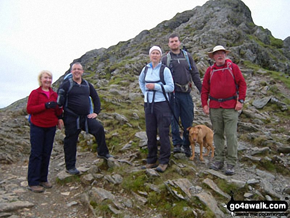 Walk c427 Helvellyn via Striding Edge from Patterdale - Family group having completed Striding Edge before the last pull up to Helvellyn.