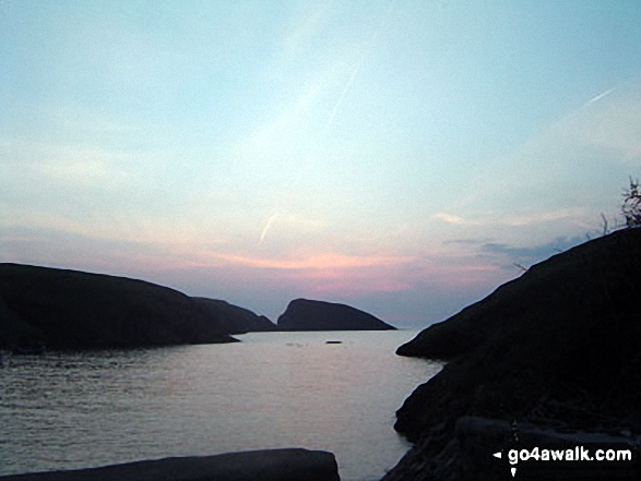 The sun setting over the bay at Abercastle