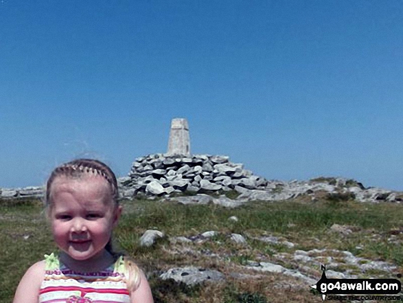 My 4 year old daughter at the trig point on top of Holyhead Mountain