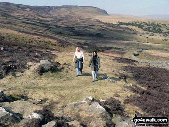 Jakie and Emma trekking up Noon Hill (Cronkley Fell)