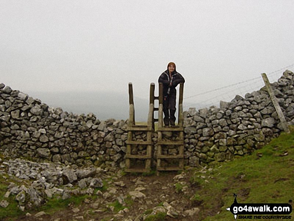 Walk ny333 The Yorkshire Three Peaks Challenge as a 3 day walk - Day 3 from Horton in Ribblesdale - The final stile in Horton in Ribblesdale at the end of the Yorkshire Three Peaks of Challenge Walk