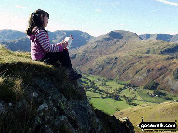 Walk c304 Beda Head and Place Fell from Howtown - My daughter taking in the wise words of Wainwright on Angletarn Pikes