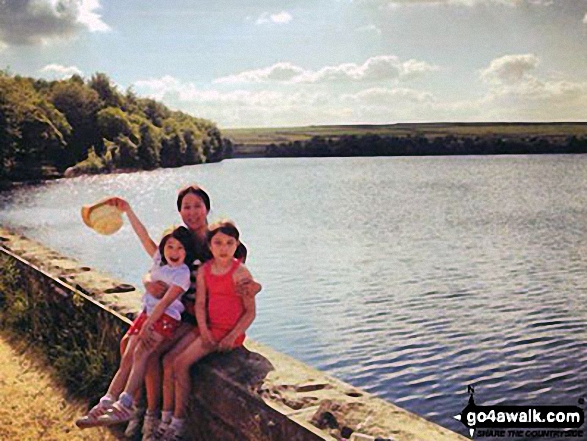 A family walk around Blackmoorfoot Reservoir near Huddersfield on a sunny afternoon