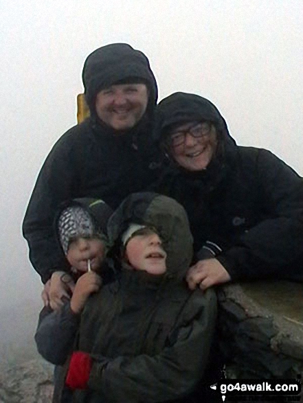 Walk gw134 Mount Snowdon (Yr Wyddfa) avoiding Crib Goch from Pen-y-Pass - The Johnson-Holme Family on the summit of Mount Snowdon