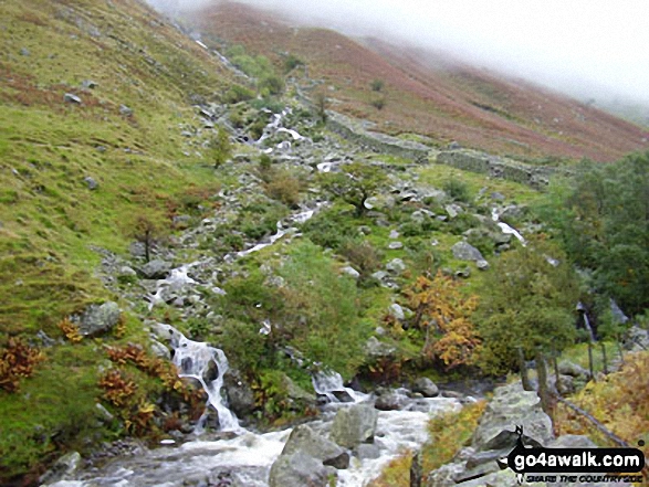 A beck in spate entering Greenup Gill