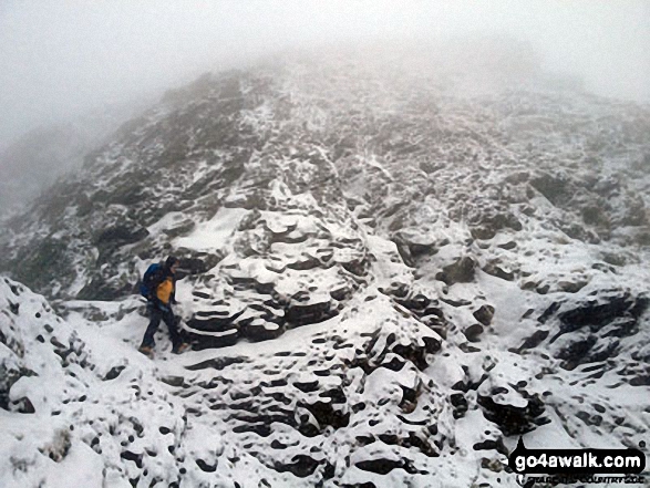 Walk c383 Blencathra via Sharp Edge from Scales - My mate Rich just strolling past the 'Bad Step' on Sharp Edge  without really noticing it!