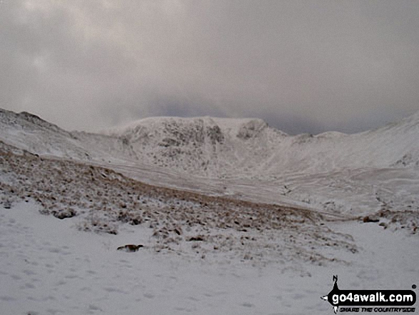 Walk c427 Helvellyn via Striding Edge from Patterdale - Helvellyn Summit flanked by Striding Edge (left) and Swirral Edge (right) from Hole-in-the-Wall in the snow