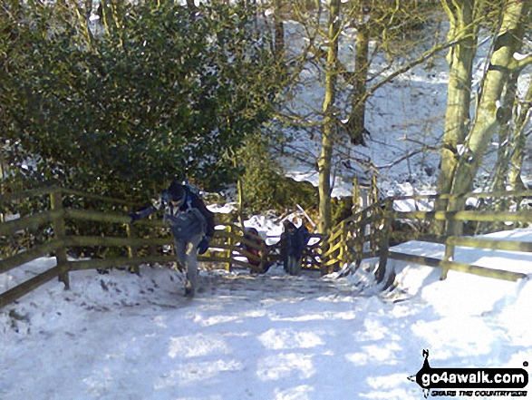 Climbing back out of the Grinds Brook valley in the snow and ice at Edale