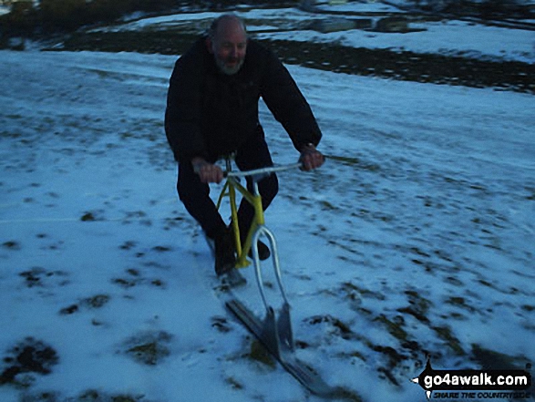 Stretchneck Sheep Shepherd on his 'ski-bike' on The Dodd