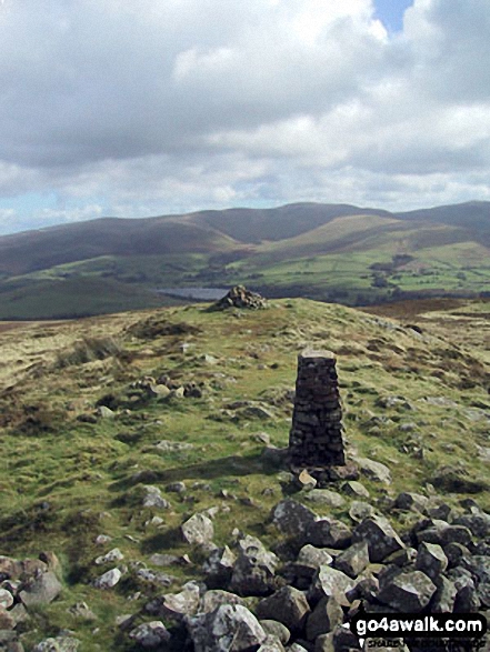 Binsey Trig Point and cairn with The Uldale Fells (Brae Fell, Great Sca Fell and Knott) beyond