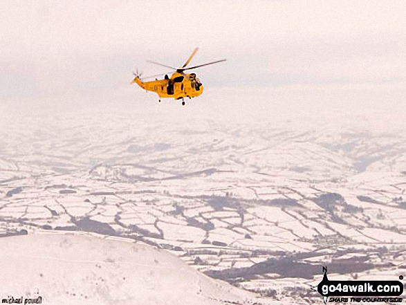 Walk po107 Y Gyrn, Corn Du and Pen y Fan from The Storey Arms Outdoor Centre - Mountain Rescue helicopter above Pen y Fan in the snow