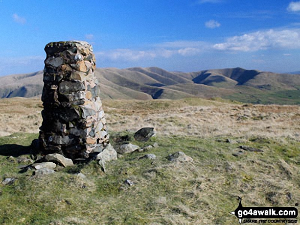 Grayrigg Forest summit trig point with The Howgill Fells in the background