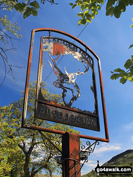 The Stagger Inn sign outside the Drovers Inn in Inverarnan