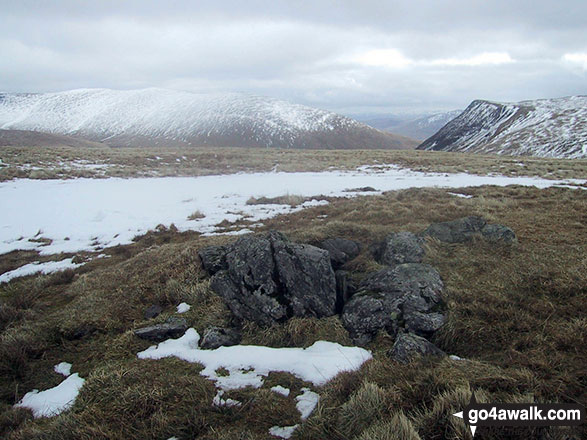 Walk c236 Skiddaw from Millbeck, nr Keswick - The rocky summit of Sale How (Skiddaw) in the snow with Bowscale Fell (left) and Blencathra or Saddleback with Sharp Edge clearly visible (right) on the horizon