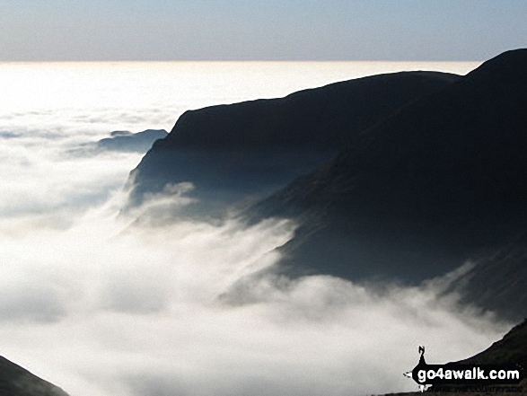 Cloud trapped by a temperature inversion clawing at the eastern slopes of Yoke, Ill Bell and Froswick as seen from Thornthwaite Crag